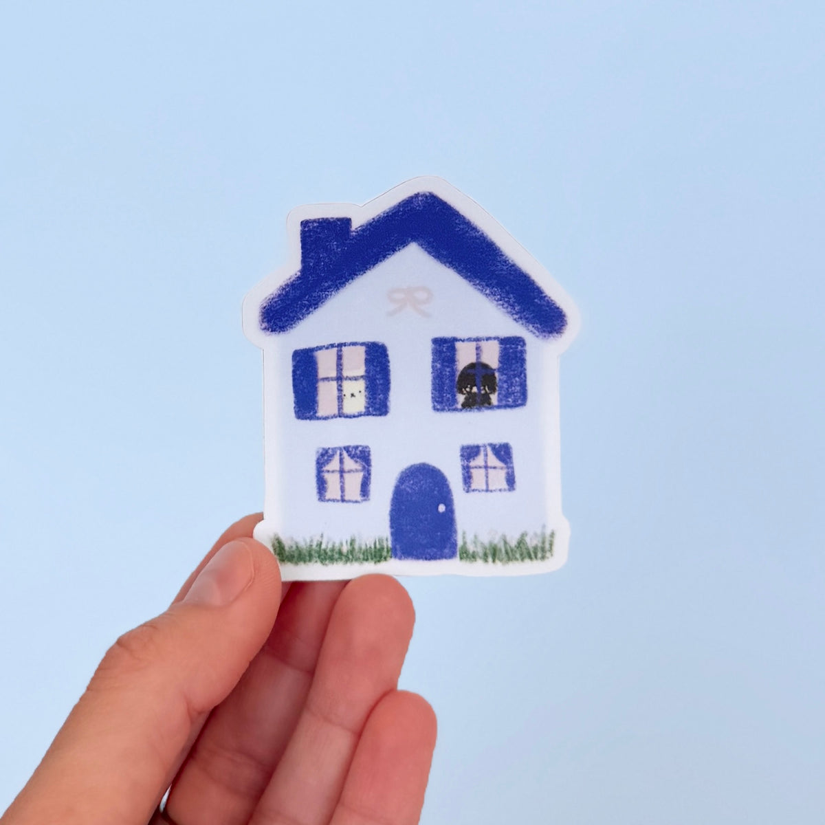 We Live in This House Sticker